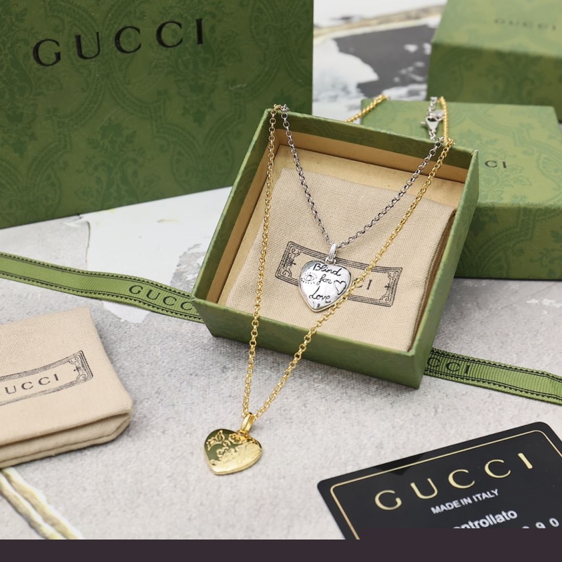 G*u*i earrings